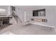 Open-concept living area with a staircase, tv, and built-in shelving adds style and storage at 2212 S Naples Way, Aurora, CO 80013