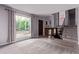 Bright living room showcases large windows, neutral paint, and staircase leading to the upper level at 2212 S Naples Way, Aurora, CO 80013