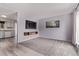 Inviting living room with gray carpet and walls; an adjacent kitchen offers a seamless transition at 2212 S Naples Way, Aurora, CO 80013