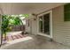 Covered patio with access to the backyard through a sliding glass door at 2212 S Naples Way, Aurora, CO 80013