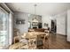 Bright dining room with hardwood floors and a view into the kitchen at 16321 Parkside Dr, Parker, CO 80134