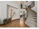 Elegant entryway with hardwood floors and a grand staircase at 16321 Parkside Dr, Parker, CO 80134