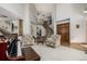 Living room with hardwood floors, high ceilings, and a grand piano at 16321 Parkside Dr, Parker, CO 80134