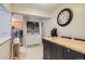 Practical laundry area with washer, dryer, and storage, seamlessly integrated into the kitchen at 4643 S Lowell Blvd # B, Denver, CO 80236