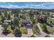 Beautiful aerial view of a home settled among the trees, showcasing the serene neighborhood and landscaping at 8446 Lightening View Dr, Parker, CO 80134
