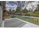 Outdoor deck overlooking a grassy backyard with a play structure and trampoline at 8446 Lightening View Dr, Parker, CO 80134