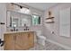 Stylish bathroom with a patterned tile floor, double vanity and decorative shelving at 8446 Lightening View Dr, Parker, CO 80134
