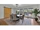 The dining room is lit by a modern light fixture and filled with natural light from surrounding windows at 8446 Lightening View Dr, Parker, CO 80134