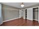 Bedroom featuring hardwood floors, chandelier lighting, closet, and doorway access at 8446 Lightening View Dr, Parker, CO 80134