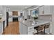 Modern kitchen with a center island, white cabinets, and bar seating, perfect for entertaining at 8446 Lightening View Dr, Parker, CO 80134