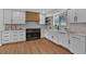 Bright kitchen features white cabinets, stainless steel appliances, butcher block countertops, and wood flooring at 8446 Lightening View Dr, Parker, CO 80134