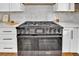 Close up of a large stainless steel range and oven with white cabinetry and hardware in the background at 8446 Lightening View Dr, Parker, CO 80134