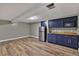 Functional kitchenette with modern appliances, ample cabinet space, and wood-look flooring at 8446 Lightening View Dr, Parker, CO 80134