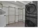 Laundry room featuring a modern washer/dryer, and wire shelving at 8446 Lightening View Dr, Parker, CO 80134