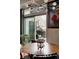 View of balcony with hanging egg chair and unique lighting fixture indoors at 2460 W 29Th Ave # 104, Denver, CO 80211