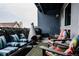 Inviting outdoor space with comfortable seating, a modern fireplace, and stylish decor at 2460 W 29Th Ave # 104, Denver, CO 80211
