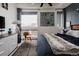 Comfortable bedroom with a ceiling fan, rug, a large window and stylish accents at 2460 W 29Th Ave # 104, Denver, CO 80211
