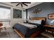 Stylish bedroom with a large window, unique art, and a comfortable bed at 2460 W 29Th Ave # 104, Denver, CO 80211