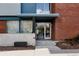 Attractive entrance to Ayr Lofts featuring modern brick facade and signage at 2460 W 29Th Ave # 104, Denver, CO 80211