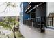 Modern blue building featuring sleek metal railings and a concrete base, offering urban living appeal at 2460 W 29Th Ave # 104, Denver, CO 80211