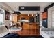 Inviting kitchen and dining area with wood cabinets and modern appliances at 2460 W 29Th Ave # 104, Denver, CO 80211