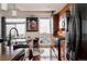 Modern kitchen with stainless steel appliances, island seating, and lots of light at 2460 W 29Th Ave # 104, Denver, CO 80211