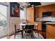 Eat-in kitchen features wood cabinets and plenty of room to eat at 2460 W 29Th Ave # 104, Denver, CO 80211