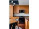 Bright kitchen with stainless steel appliances and modern cabinets at 2460 W 29Th Ave # 104, Denver, CO 80211