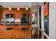 Modern kitchen boasts stainless steel appliances, sleek countertops, and stylish seating at the island at 2460 W 29Th Ave # 104, Denver, CO 80211