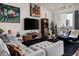 Modern living room with gray sofa, unique art, and stylish decor at 2460 W 29Th Ave # 104, Denver, CO 80211