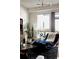 Cozy living room featuring unique furnishings, plant accents, and ample natural light at 2460 W 29Th Ave # 104, Denver, CO 80211
