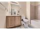 Bathroom featuring a sink, toilet, bathtub, and shower at 9569 Pearl Cir # 204, Parker, CO 80134