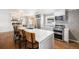 Bright kitchen with white cabinets, quartz countertops and island at 741 S 6Th Ave, Brighton, CO 80601