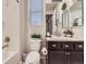 Cozy bathroom featuring a shower and vanity with decorative plants at 18280 W 85Th Dr, Arvada, CO 80007