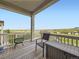 Comfortable back deck offers amazing views of the mountains and neighborhood, complete with outdoor seating at 18280 W 85Th Dr, Arvada, CO 80007