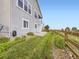 Two-story home with well maintained landscaping and a wooden fence in the backyard at 18280 W 85Th Dr, Arvada, CO 80007