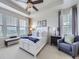 Spacious main bedroom with trey ceilings, large windows offering bright natural light, and a sitting area at 18280 W 85Th Dr, Arvada, CO 80007