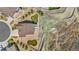 Aerial view of the property showcasing the home's layout and outdoor spaces, including the fire pit and back patio at 2065 Sage Grouse Way, Castle Rock, CO 80109