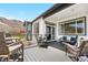 Spacious back deck with stylish outdoor furniture, mountain views, and privacy fencing at 2065 Sage Grouse Way, Castle Rock, CO 80109