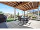 Relaxing covered patio featuring outdoor furniture, a barbecue grill, and mountain views at 2065 Sage Grouse Way, Castle Rock, CO 80109
