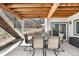 Covered patio features outdoor seating area, a grilling area, and backyard views at 2065 Sage Grouse Way, Castle Rock, CO 80109