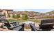 Backyard view of an outdoor fire pit area with seating, surrounded by trees and mountain views at 2065 Sage Grouse Way, Castle Rock, CO 80109