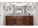 Well-lit bathroom with a large double vanity, granite counters, and modern fixtures at 2065 Sage Grouse Way, Castle Rock, CO 80109