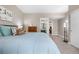 Comfortable bedroom featuring a large bed, soft blue comforter, and neutral decor for a relaxing atmosphere at 2065 Sage Grouse Way, Castle Rock, CO 80109
