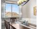 Dining room boasts a scenic view, a chandelier, and space for Gathering gatherings at 2065 Sage Grouse Way, Castle Rock, CO 80109