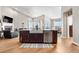 Open kitchen with a farmhouse sink, stainless steel appliances, and views of the living and dining areas at 2065 Sage Grouse Way, Castle Rock, CO 80109
