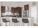 Modern kitchen with granite countertops, stainless steel appliances, and a breakfast bar with seating at 2065 Sage Grouse Way, Castle Rock, CO 80109