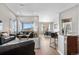 Spacious open-concept living area with bright lighting and an adjacent dining area at 2065 Sage Grouse Way, Castle Rock, CO 80109