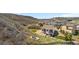 Charming property with a backyard fire pit, lush lawn, and outdoor living spaces, perfect for relaxation at 2065 Sage Grouse Way, Castle Rock, CO 80109