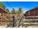 Charming backyard with a wooden fence and gate creating a private and secure outdoor space at 2291 W 54Th Ave, Denver, CO 80221
